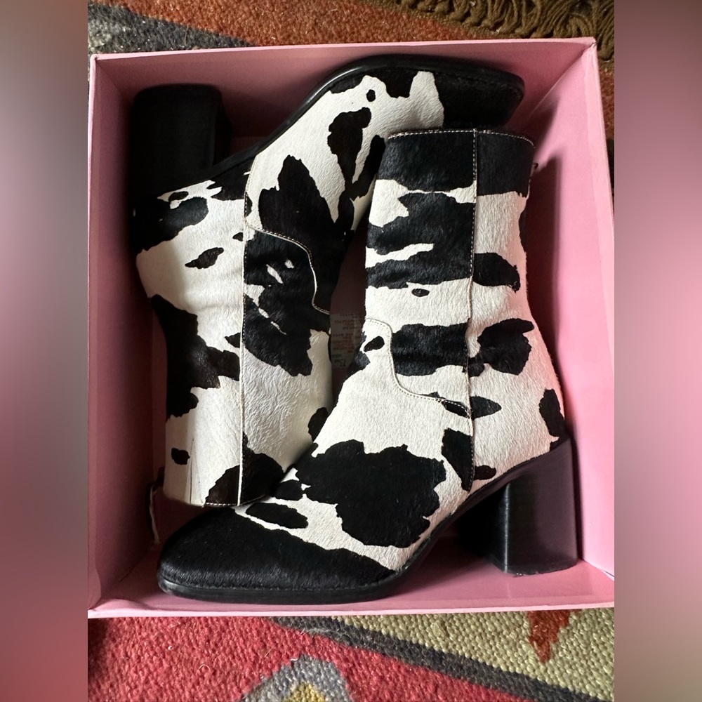 intentionally blank PG cow print boots.